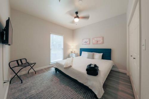 a bedroom with a bed with a backpack on it at Minutes to Broadway/ 2 KING beds and with FREE garage parking in Nashville