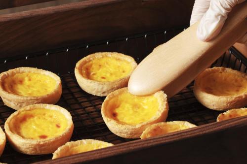 a wooden spoon in a basket of food at the b osaka-shinsekai in Osaka