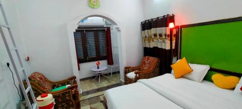 Ένα ή περισσότερα κρεβάτια σε δωμάτιο στο Eastern Gate Homestay