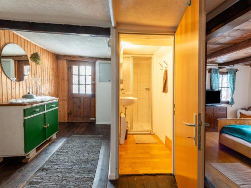 a small room with a bathroom and a bedroom at Quaint farmhouse in Bramberg am Wildkogel in Neukirchen am Großvenediger