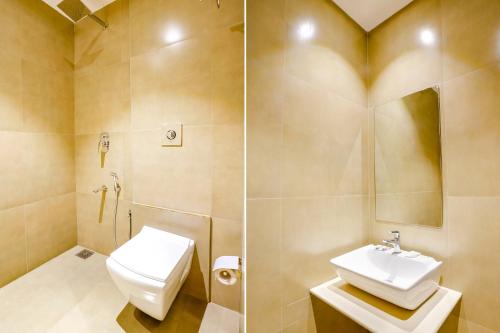 a bathroom with a toilet and a sink at The Azure in Mumbai