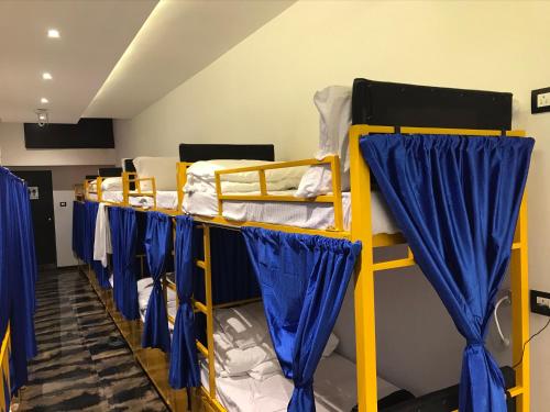 Postel nebo postele na pokoji v ubytování New Mango Dormitory