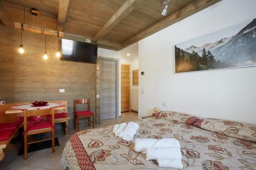 Ένα ή περισσότερα κρεβάτια σε δωμάτιο στο Dolomiti Comfortspace Free Parking
