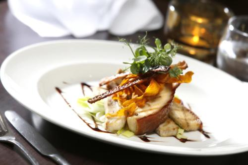 a white plate of food on a table at Best Western Ship Hotel in Weybridge