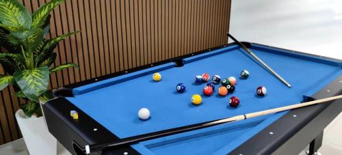a pool table with balls and a cue at 19pax Ipoh Semi-D W/Pool Table & Karaoke ISD03 R in Ipoh