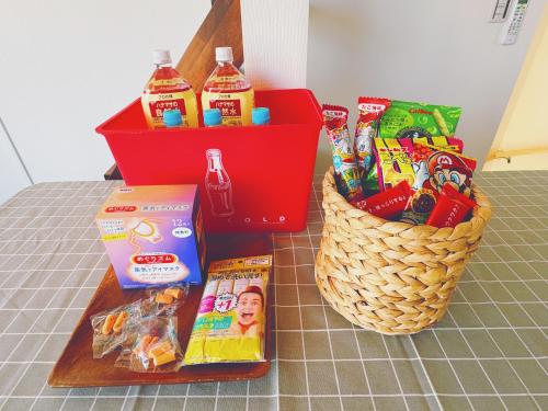 a table topped with a basket of food and drinks at 枕木 New house with Huge View for Family-Group in Tokyo