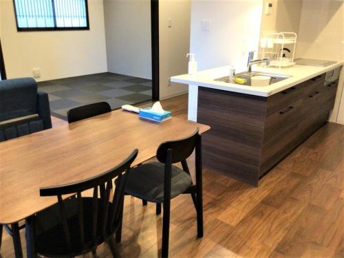 a kitchen and dining room with a table and a sink at THE VIEW Odawara shiro-no mieru hotel - Vacation STAY 63560v in Odawara