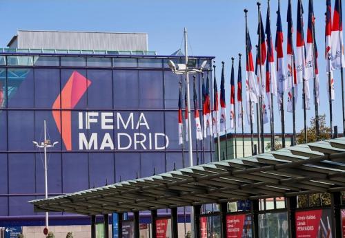 a group of flags on the side of a building at Apartamento Ifema Aeropuerto Metropolitano in Madrid