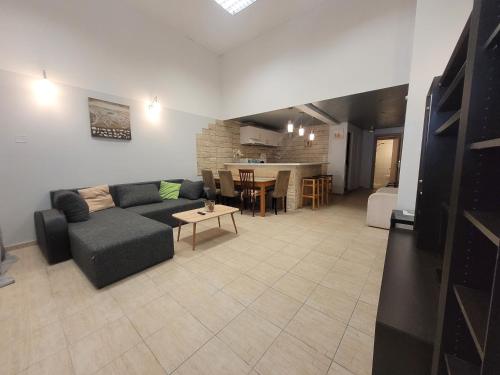 a living room with a couch and a table at center apartments in Lefkada Town