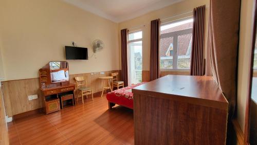 TV a/nebo společenská místnost v ubytování Đông Đức Hostel Đà Lạt
