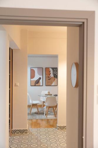 a room with a table and chairs in a room at Panagiotidis lake house in Kastoria