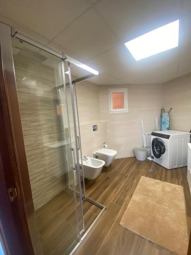 a bathroom with a shower and two toilets at Luxury Penthouse Playas de torrevieja 6pax in Torrevieja