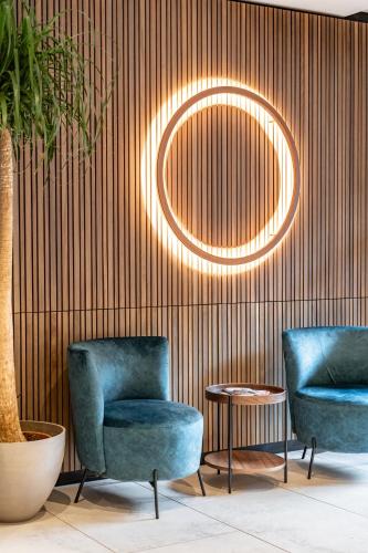 two chairs and a table in a room at Hotel Lokomotive in Linz