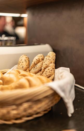 a basket filled with bread on top of a table at Hotel Lokomotive in Linz