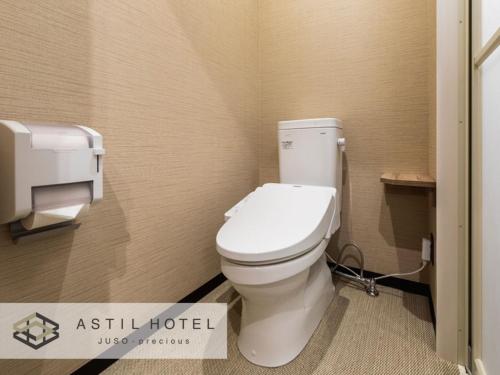 a bathroom with a white toilet in a stall at Astil Hotel Juso Precious - Vacation STAY 16022v in Osaka