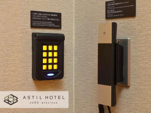an aswell hotel alarm clock on a wall at Astil Hotel Juso Precious - Vacation STAY 16022v in Osaka