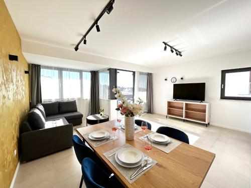a living room with a table and a couch at Sandi Hvar Apartments in Hvar