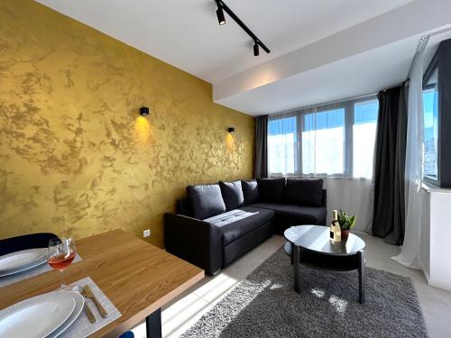 a living room with a couch and a table at Sandi Hvar Apartments in Hvar