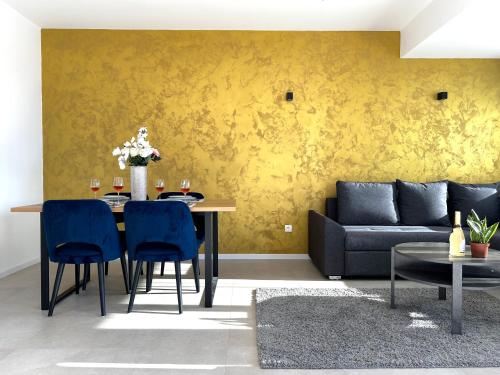 a living room with a table and a couch at Sandi Hvar Apartments in Hvar