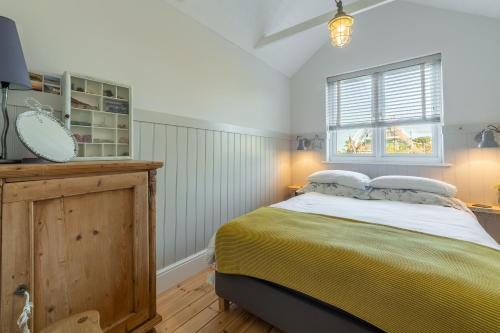 Voodi või voodid majutusasutuse Barnwell Cottage toas