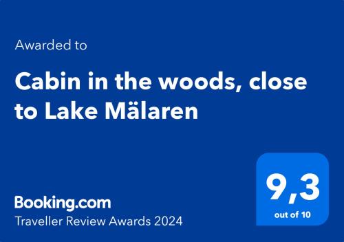 a blue sign with the text callin in the woods close to lake milken at Cabin in the woods, close to Lake Mälaren in Eskilstuna