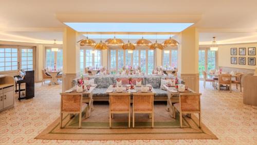 a large dining room with tables and chairs at Gateway Coonoor in Coonoor