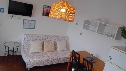 a living room with a couch and a table at Penzión Vilka Podhájčanka in Podhájska