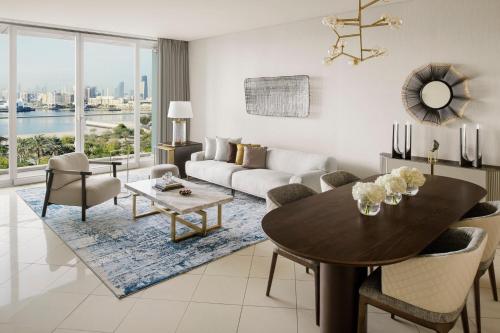 a living room with a table and a couch at InterContinental Residence Suites Dubai Festival City by IHG in Dubai