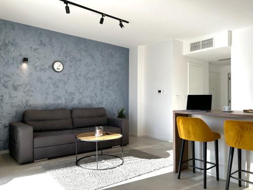 a living room with a couch and a table at Sandi Hvar Apartments in Hvar