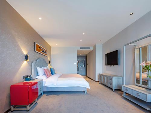 Vanbrugh Bay Hotel - Zhangjiajie Tianmen Mountainにあるベッド