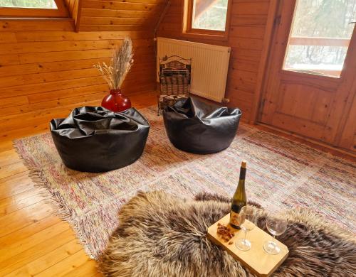 a room with two black bags and a bottle of wine at ForrestHouse in Zetea