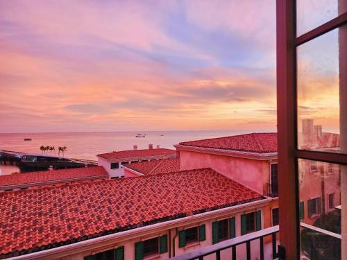 a view of the ocean from a building at Sea Sunset Hotel Phu Quoc - Welcome to a mixing world of friends in Phu Quoc