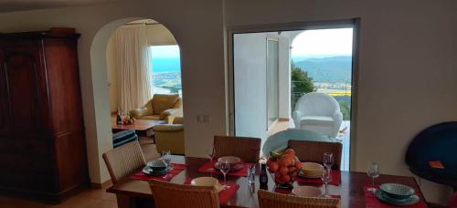 a dining room with a table and chairs with a view at Villa Mas Nou in Castillo de Aro