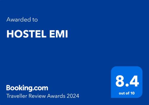 a blue screen with the text upgraded to hostel emm travelling review awards at HOSTEL EMI in Kavadarci