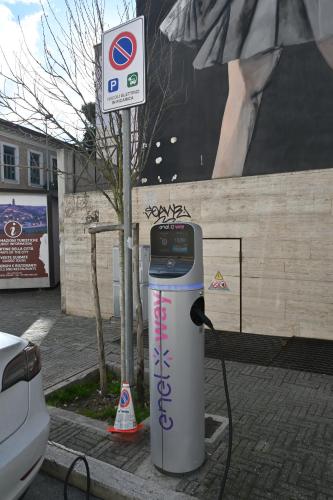 a gas pump sitting on the side of a street at Profumi di Primavera Luxury Rooms & Suite in Matera