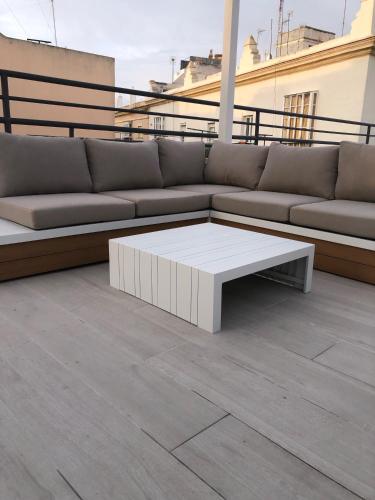 a couch sitting on top of a roof at Apartamentos GADIR CENTRO in Cádiz