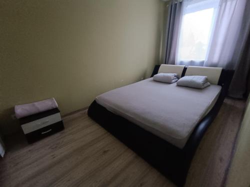 Un pat sau paturi într-o cameră la Rahu34