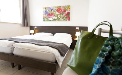 Łóżko lub łóżka w pokoju w obiekcie Appartamenti Al Vigneto
