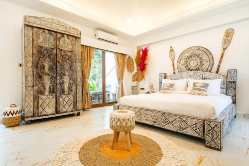 a bedroom with a large bed and a large window at CSR Landmark Resorts in Coimbatore