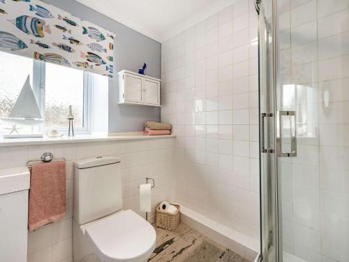 a bathroom with a toilet and a shower at 2 Bed in Narberth 84026 in Narberth