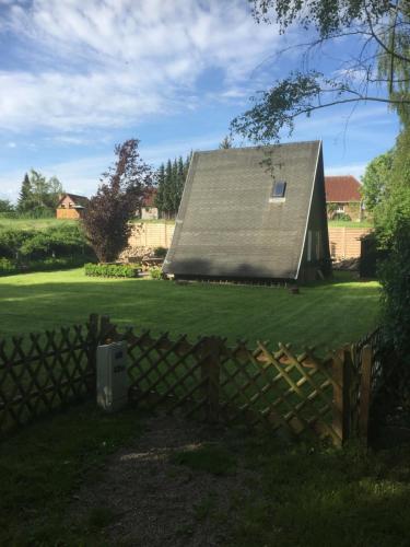 Κήπος έξω από το Ferienhaus Typ - Finnhütte