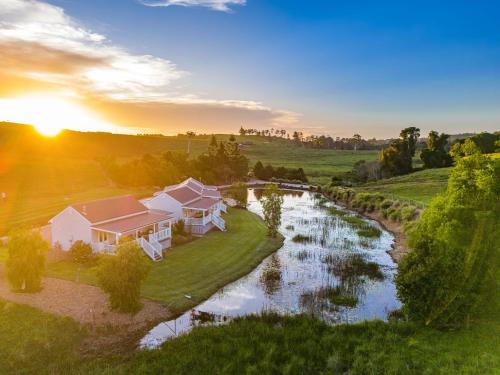 an aerial view of a house and a river at Forget Me Not Farm Cottages in Coopers Shoot