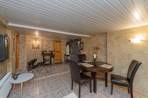 a dining room with a table and chairs and a room at Spacious Studio apartment by Polo apartments in Kaunas