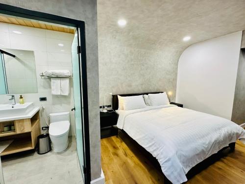 En eller flere senge i et værelse på 水秀一方Sun Moon Lakeside Boutique Hotel