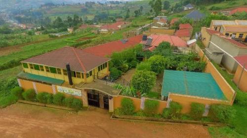 an aerial view of a house with a swimming pool at WAYPOINT SUITES HOTEL in Kabale
