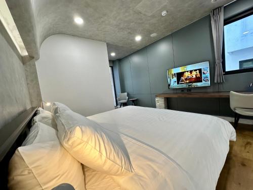 En eller flere senge i et værelse på 水秀一方Sun Moon Lakeside Boutique Hotel