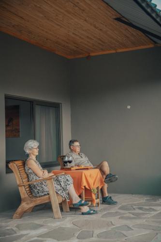 a man and a woman sitting at a table at Africa Awaits Lodge & Safaris in Gobabis