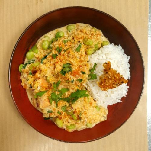 a brown plate of food with rice and peas at Novotel Paris Est in Bagnolet