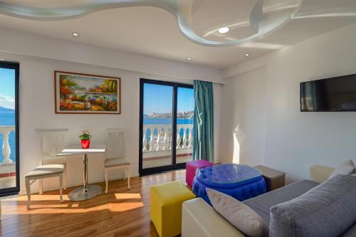 a living room with a couch and a table at Hotel Iliria in Sarandë