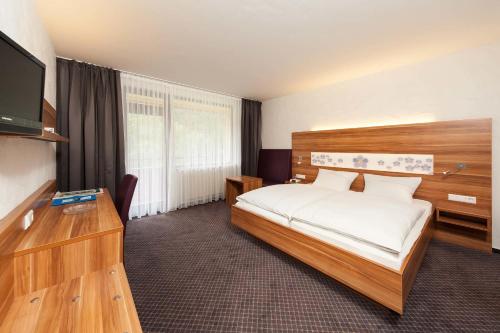 Postel nebo postele na pokoji v ubytování Hotel Vergissmeinnicht